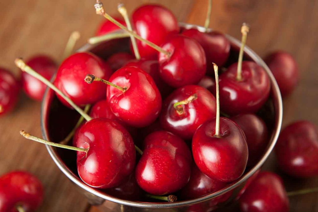 Cherries in a metal bowl