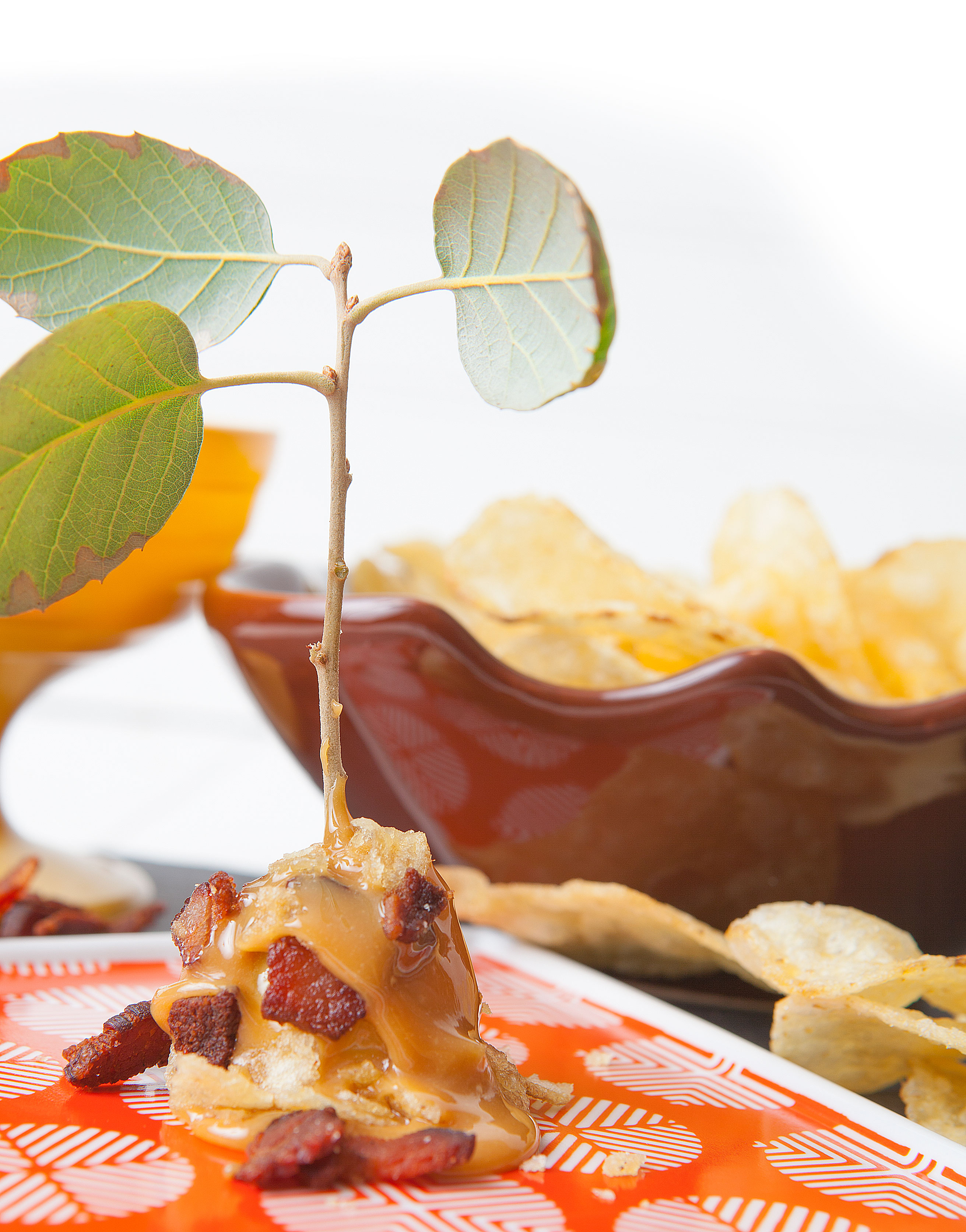 The Significant Other Dip apple into warm melted caramel, turning to coat evenly. Dip caramel-coated apple into crushed salted potato chips and then dip again into cooked bacon bits, coating evenly. - Jen